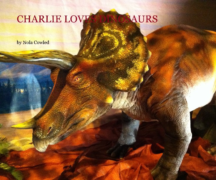 View charlie loves dinosaurs by Nola Cowled