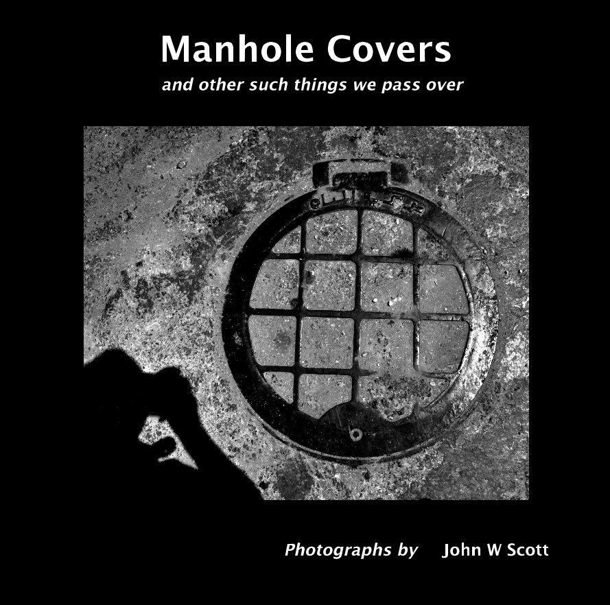 View Manhole Covers and other such things we pass over by Photographs by John W Scott