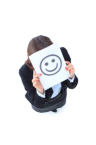 Young Business Woman Hiding behind a Smiley Face book cover